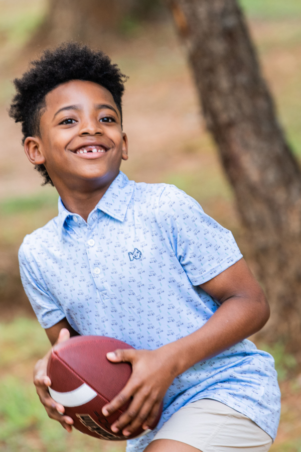 Boys' Short Sleeve Pro Performance Polo in Powder Blue Golf Cart Print